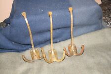 3 porte manteaux en bronze