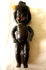 Ancienne poupée noire bien potelée avec chignon et B.O.