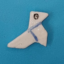 Fève 1ère époque COCOTTE dite "cocotte en papier" porcelaine émaillée ALLEMANDE