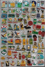 lot de 85 pin's boissons : vittel (dont 1 ab),oasis,volvic,perrier,coca cola....