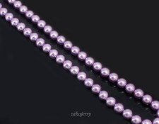 Perle de Tahiti ronde naturelle couleur violette de la mer du Sud indonésienn...