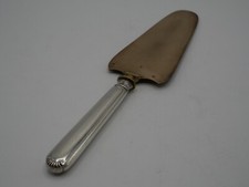 PELLE A TARTE MANCHE ARGENT