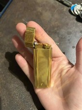 Briquet Cartier plaqué or luxe fonctionnel Cartier Trinity gold plated lighter