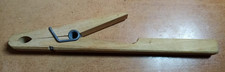 Pince en bois pour tube à