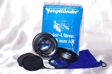 Objectif 55mm f1,4 VOIGTLÄNDER, bouchons, boïte, filtre, pare-soleil, housse TBE