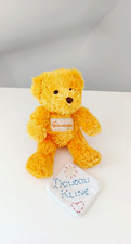 Peluche/Doudou Petit Ours Assis Jaune/Orange Nez Marron 19cm  - Parc Futuroscope
