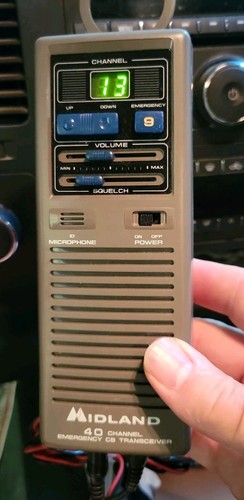 Midland hand held radio - hand,