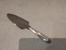 Pelle à tarte coupante métal