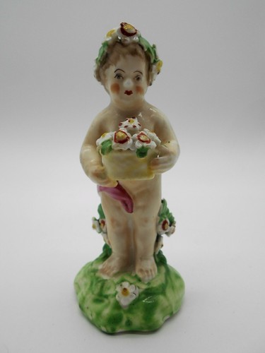 Figurine enfant aux - aux, en