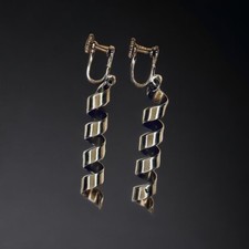 Jolie paire de boucles d’oreilles dorées et argentées fermoir à vis
