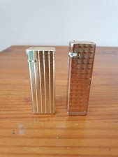 Deux briquets vintage Betty Star Korea à gaz métal dorés 2x6,5 cm