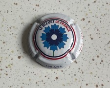 capsule de champagne MIGNON Pierre 100 ans LE BLEUET 1 série de cercle bleu blan