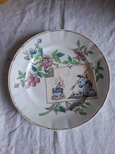 1 anciennes assiettes a dessert en faience  decor floral et scène comique