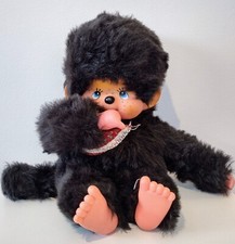 Kiki marron de 45 cm aux yeux bleus, en très bon état.