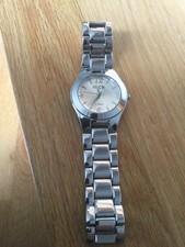 Montre acier MCK état neuf pile a changer