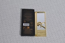 Miroir doré de sac et de