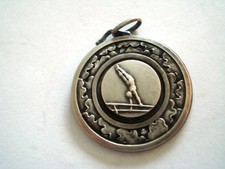 MEDAILLE SPORT BARRE FIXE