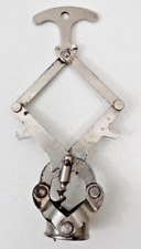 Ancien tire-bouchon extensible DEBOUCHTOUT type zig zag