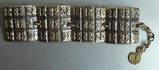 GROS BRACELET DESIGN EN BRONZE DORE - M BUFFET ?