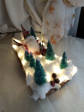 Père NOËL dans la forêt avec son ski.... enneigé....