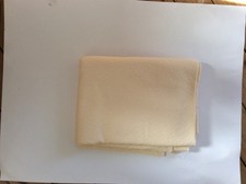 Coupon de tissu beige jaune clair