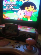 console vsmile motion vtech rose avec jeux dora motion + adaptateur secteur