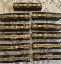 11 porte-couteaux  Art Déco en ébène Décor Argenté