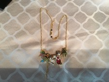 collier panthère avec zircons rouge et diverses petites pierres emaillee