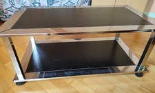 Table basse bois noir et acier, 2 plateaux sur roulettes