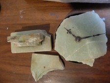 broken remains of green quartz clock parts craft upcycling