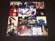 Bono Signed Achtung Baby Vinyl “The Fly”, “Mysterious Ways” Beckett Authentic
