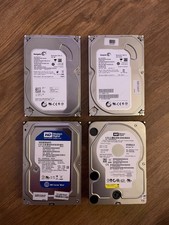 Disques durs (x4) Seagate + WD 500 Go + 500 Go 250Go + 250 Go = 1.5 To