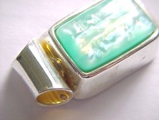 Lovely 12 ct blue green rectangular stone pendant, silver modern design.