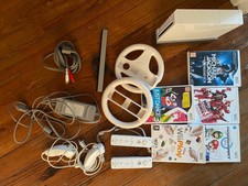 Nintendo WII blanche + accessoires + jeux + wii fit