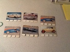 lot plaques metalliques AUTOMOBILE annees 70:ferrari,lotus chevrolet....coop!!!