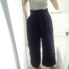 Wide-leg trousers in textured fil coupé. In excellent condition.
