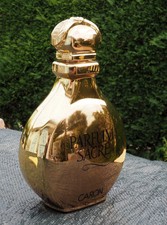 Flacon factice géant doré 31 cm Parfum sacré de Caron, signé
