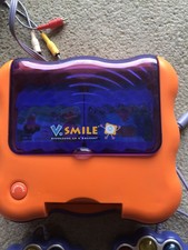 Console VSmile de Vtech +  2 manettes et 4 jeux Dora Cendrillon Nemo