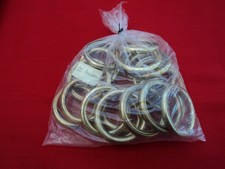 20 anneaux de Rideaux en laiton doré, voir photos.