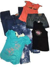 LOT FILLE 12. ANS JEAN LEVIS SLIM  ONLY JUPE BENETTON TOP DIESEL  ET 2 ROXY