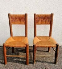 CHARLOTTE PERRIAND . LOT DE 2 ANCIENNES CHAISES PAILLE . CIRCA JEANNERET PROUVE
