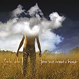 Three Seats Behind A Triangle